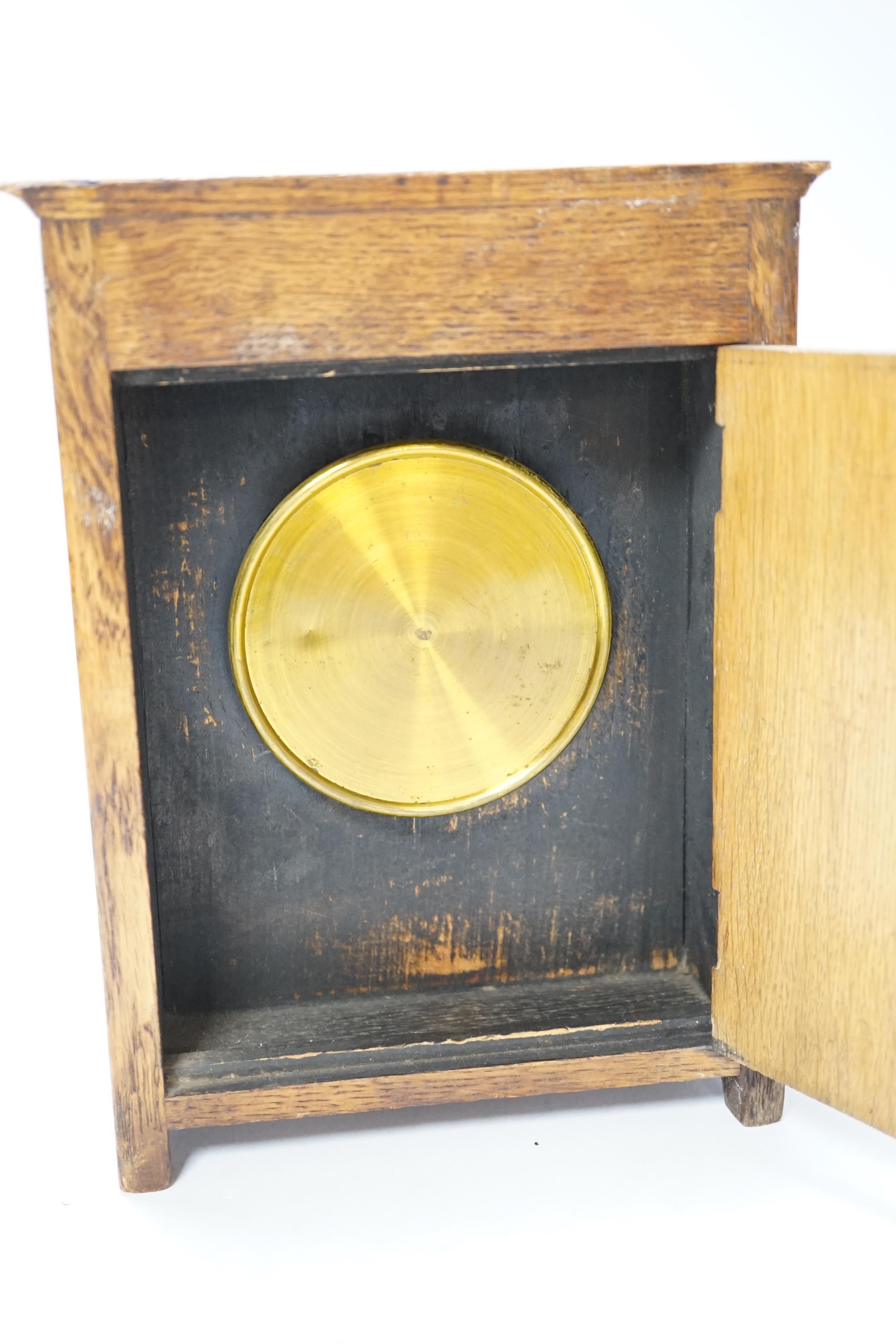 A Victorian carved oak aesthetic mantel clock, 24cm high